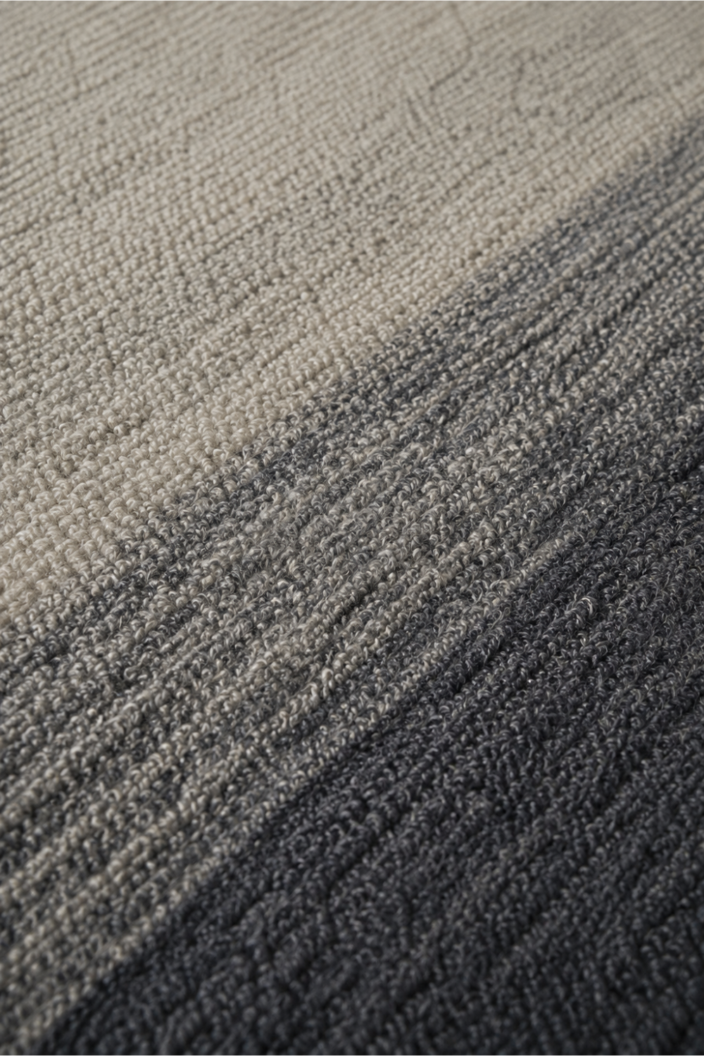 Close-up of the Stone Horizon handloom New Zealand wool rug showcasing its ivory to charcoal gradient texture and handcrafted weave