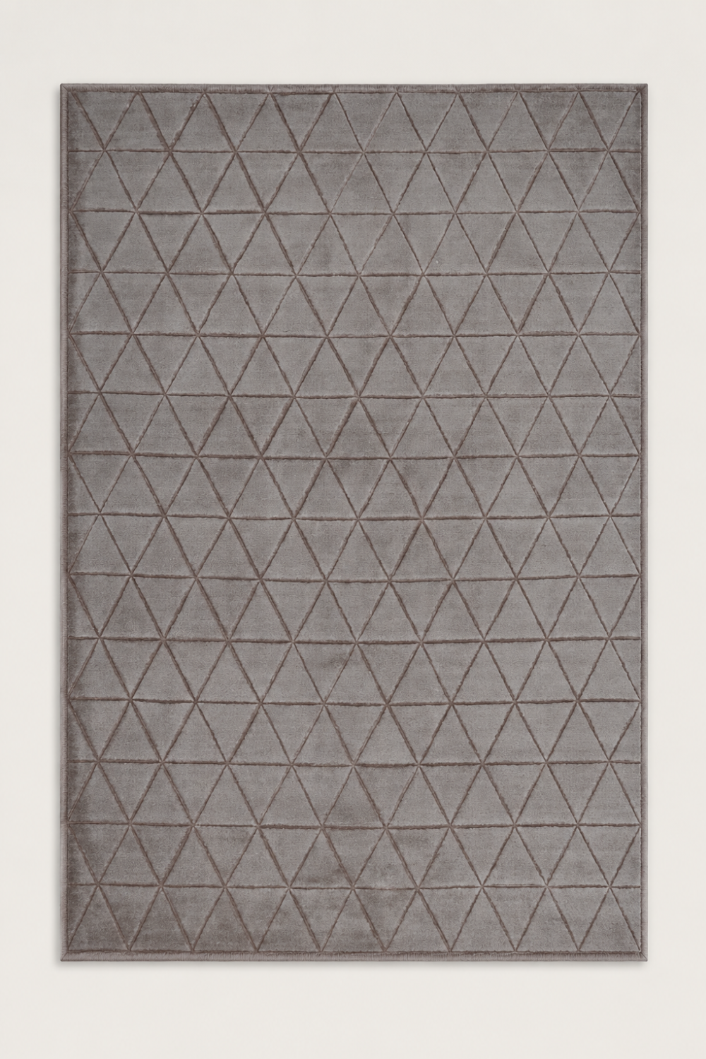 Taupe Triad Rug handcrafted in Handloom Viscose Tencel Bamboo with a repeating triangular geometric self-design in a soft taupe colour.