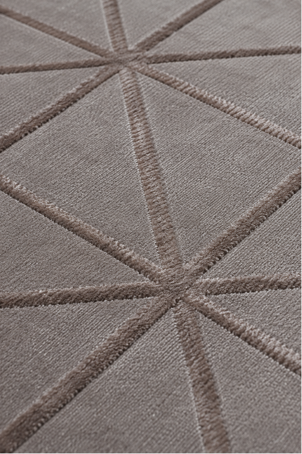 Close-up of the Taupe Triad Rug showing carved triangular geometric detailing, raised texture, and luxurious Handloom Viscose Tencel Bamboo craftsmanship.
