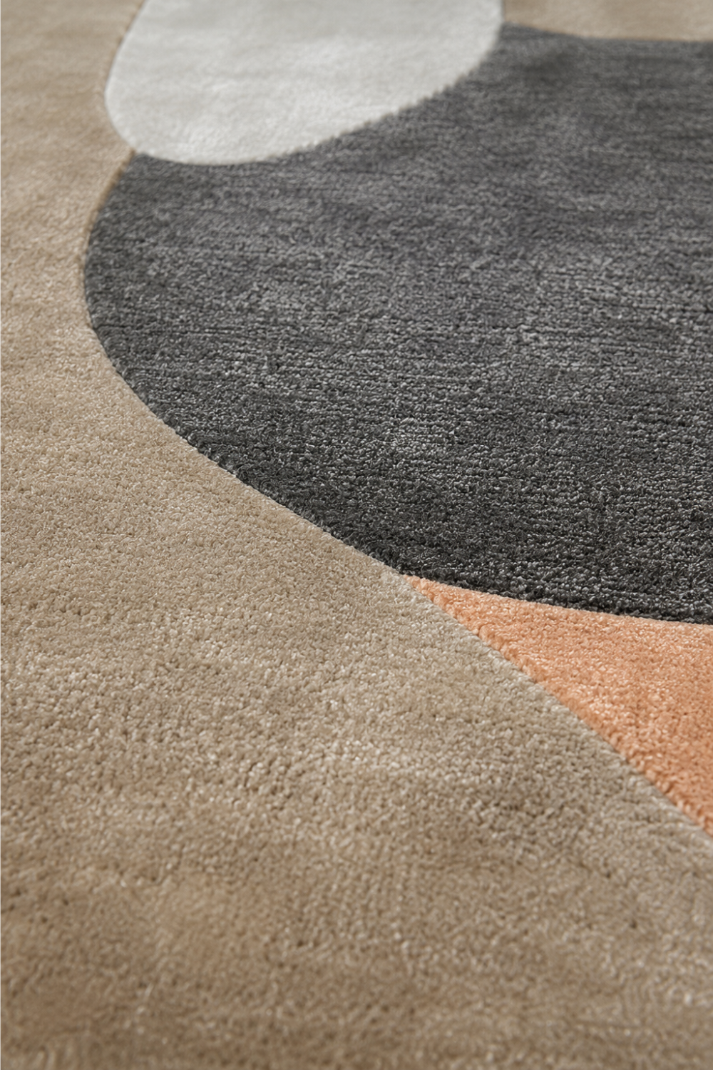Close-up texture detail of the Terra Eclipse hand tufted organic rug showcasing premium craftsmanship and sculpted pile.