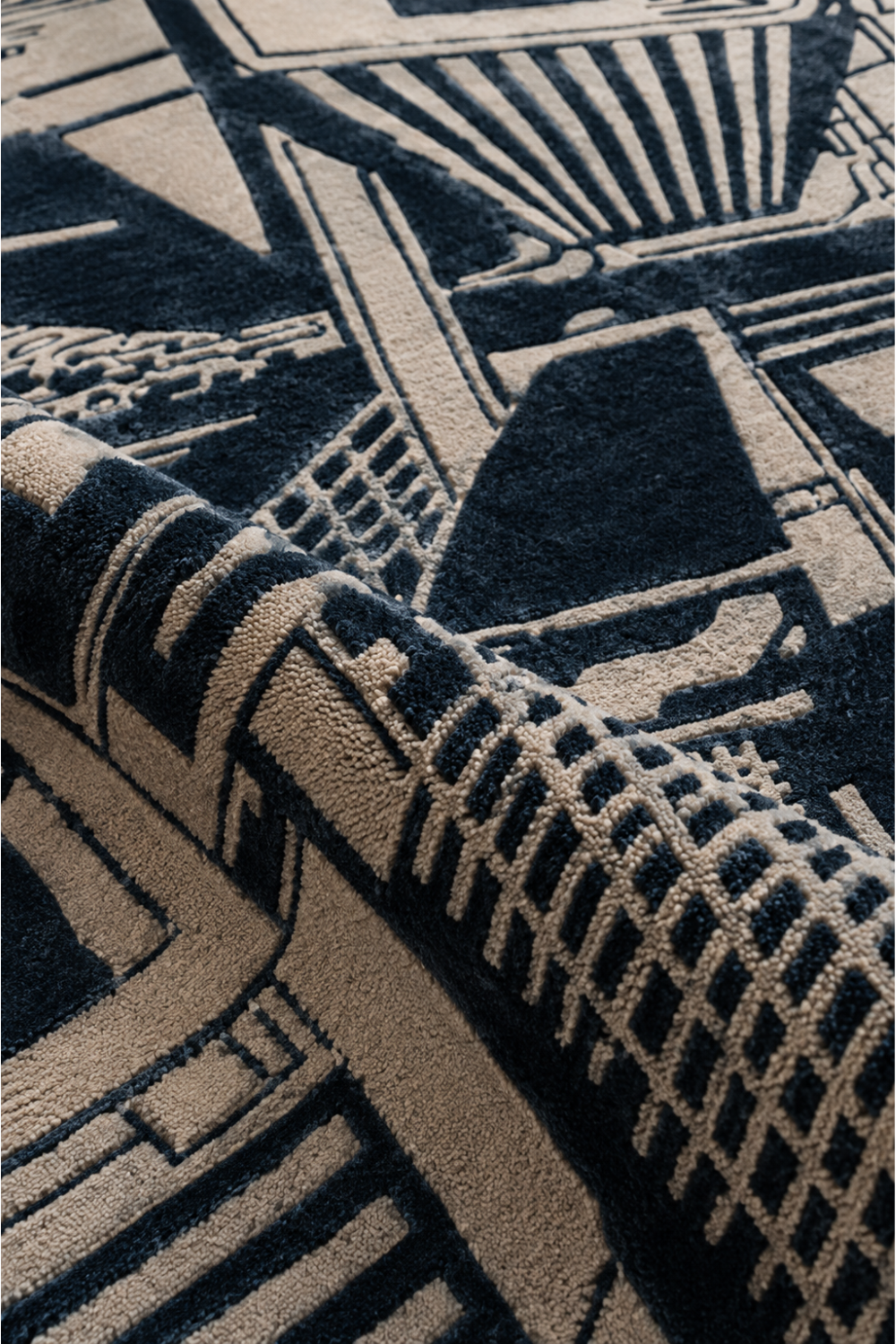 Close-up of Urban Grid rug showing tactile hand-tufted pile and raised charcoal and beige geometric detailing