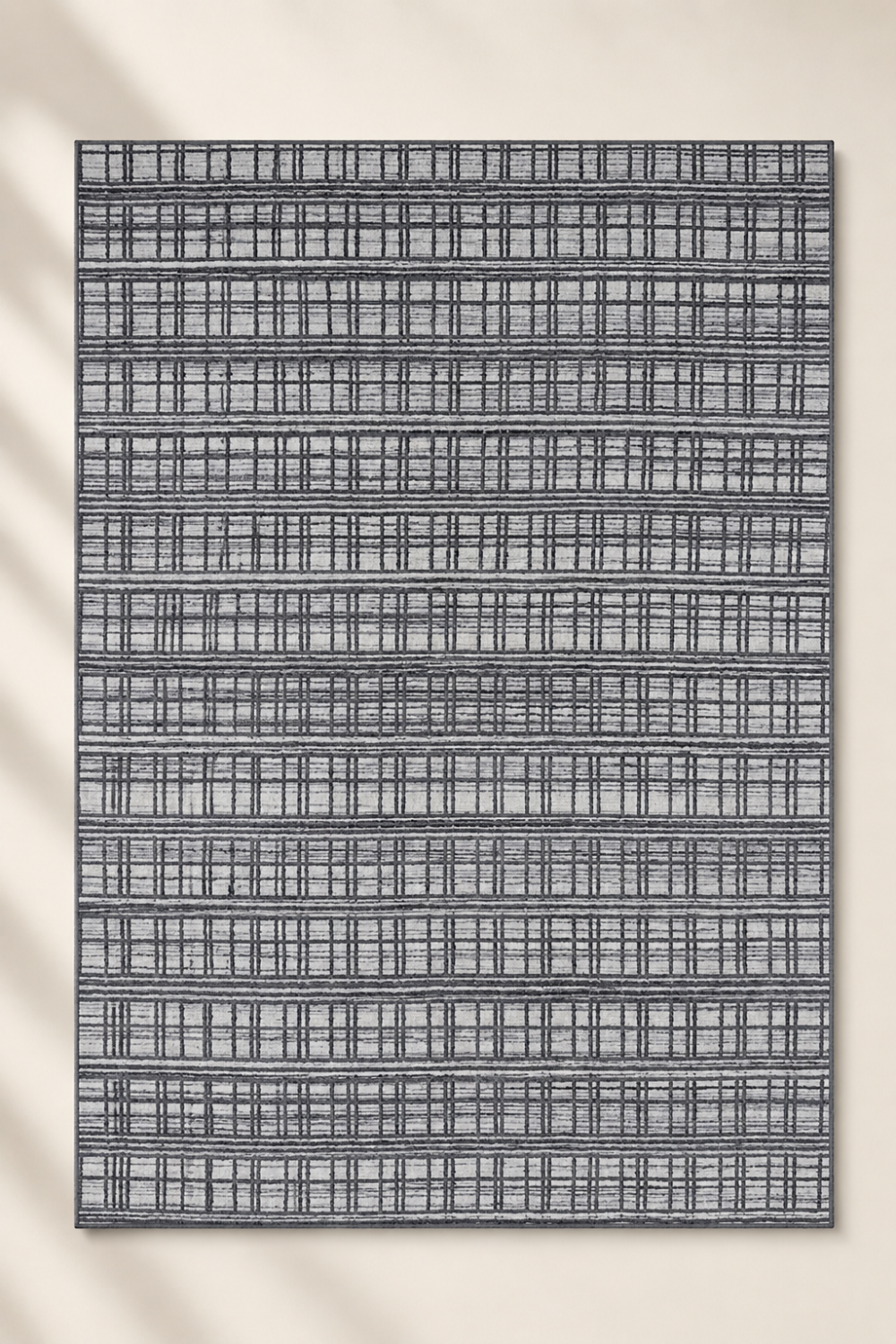 Urban Grid handloom New Zealand wool and viscose area rug featuring a contemporary architectural plaid grid pattern in charcoal grey and ivory