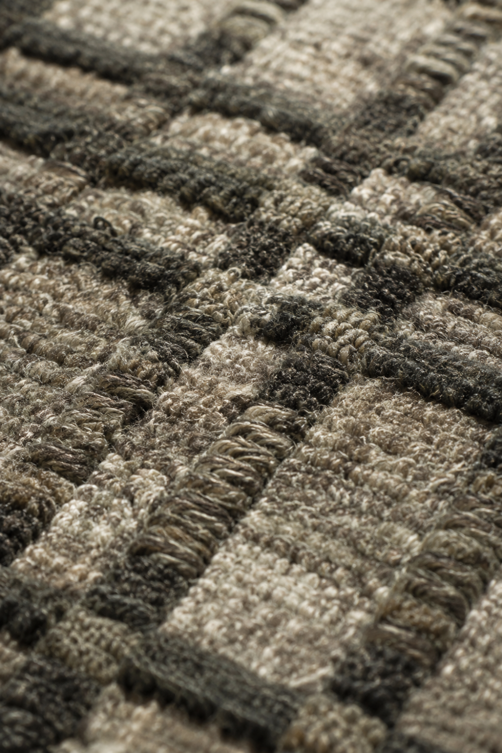 Close-up of the Urban Weave handloom wool and viscose rug showcasing its handcrafted box weave texture and dimensional surface